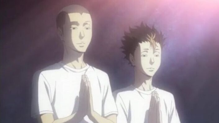 Two volleyball players achieve nirvana.