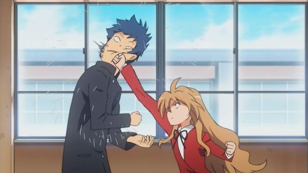 A very small girl punches an edgy guy in the face.